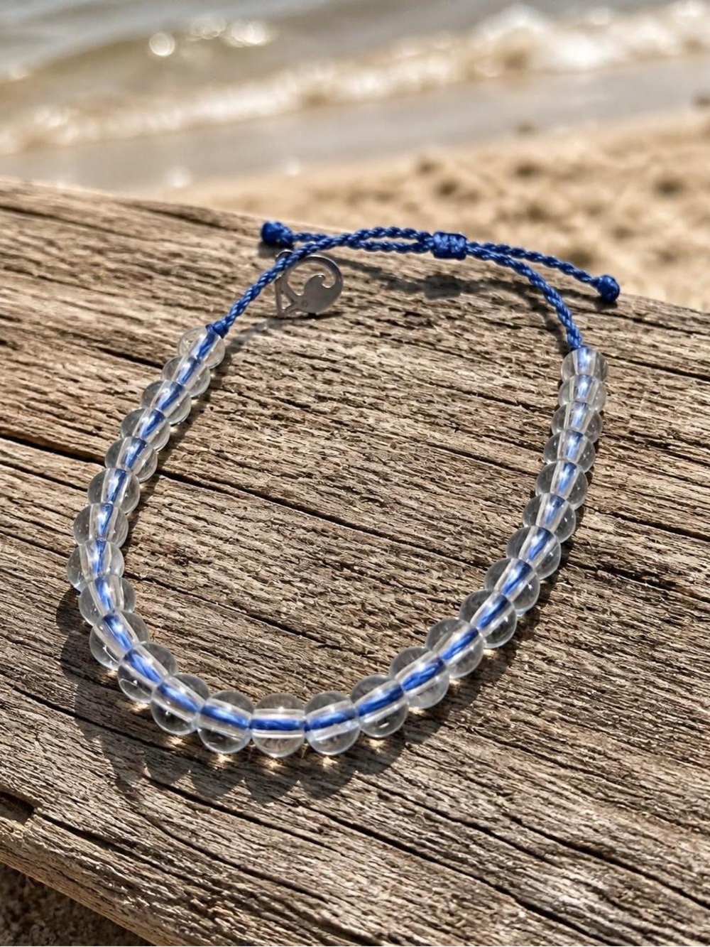 Clear Beaded Cord Bracelet with Blue Accent